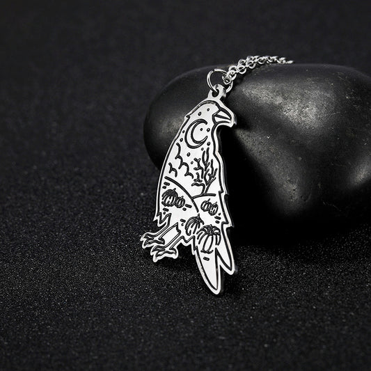 Hugin Moon raven insight pendant on dark stone