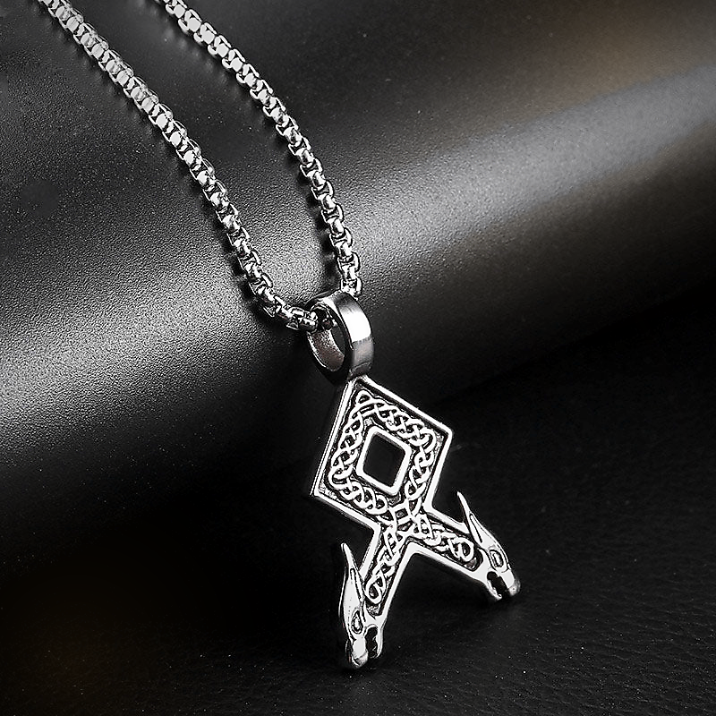 Vegvisir Path minimal Viking rune necklace on dark leather background